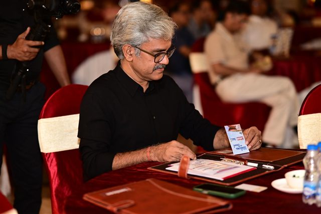 Guest completing registration at the event desk